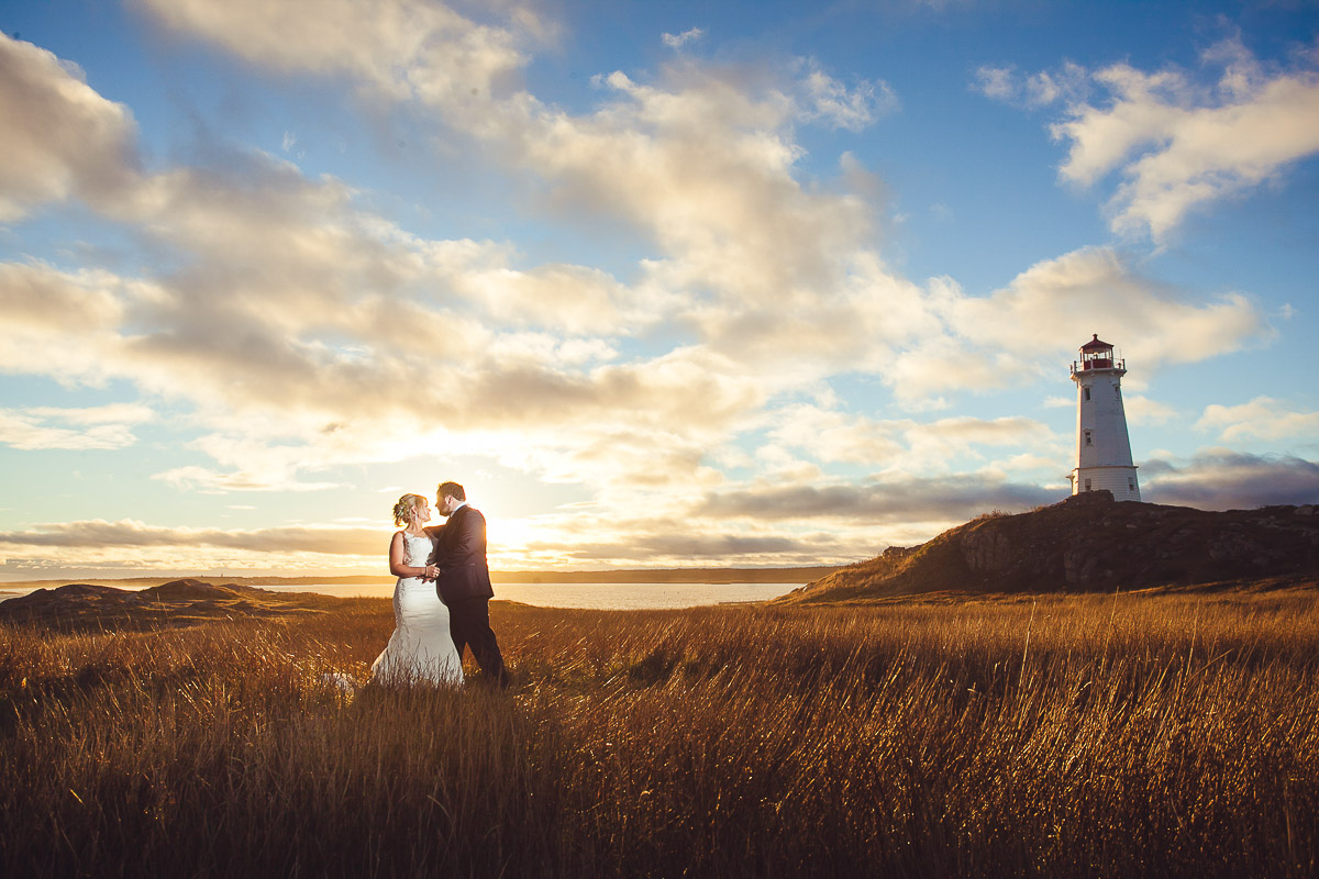 wedding photo by lighthouse in nova scotia